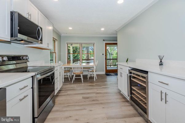 Dining room, Interior, Kitchen, Recessed Lighting, Stainless Steel Appliances, Wood Texture Flooring