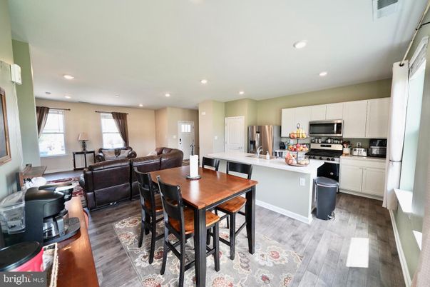 Dining room, Interior, Kitchen, Living room, Recessed Lighting, Stainless Steel Appliances, Wood Texture Flooring
