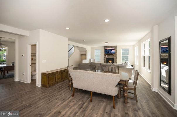 Dining room, Fireplace, Interior, Living room, Recessed Lighting, Wood Texture Flooring