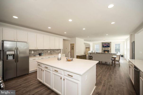 Dining room, Fireplace, Interior, Kitchen, Living room, Recessed Lighting, Stainless Steel Appliances, Wood Texture Flooring