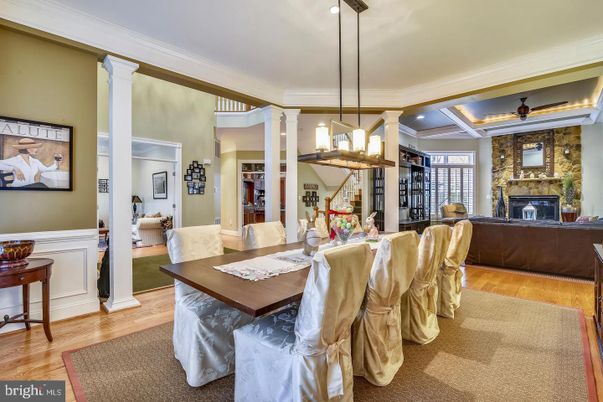 Dining room, Fireplace, Interior, Pendant Lights, Recessed Lighting, Stone Walls, Wood Texture Flooring
