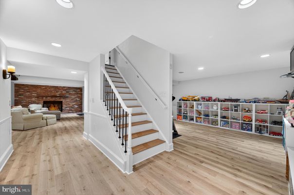 Fireplace, Interior, Living room, Recessed Lighting, Stone Walls, Wood Texture Flooring