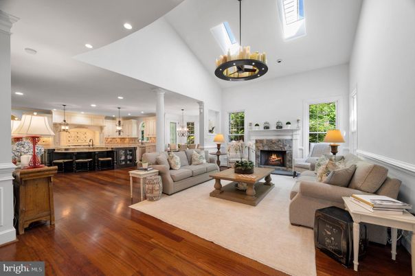 Chandelier, Fireplace, Interior, Kitchen, Living room, Pendant Lights, Recessed Lighting, Wood Texture Flooring