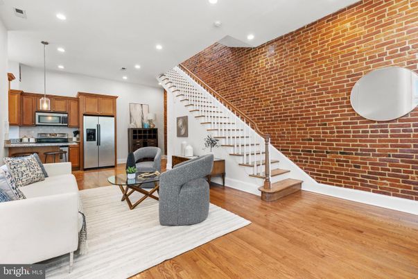 Interior, Kitchen, Living room, Pendant Lights, Recessed Lighting, Stainless Steel Appliances, Stone Walls, Wood Texture Flooring