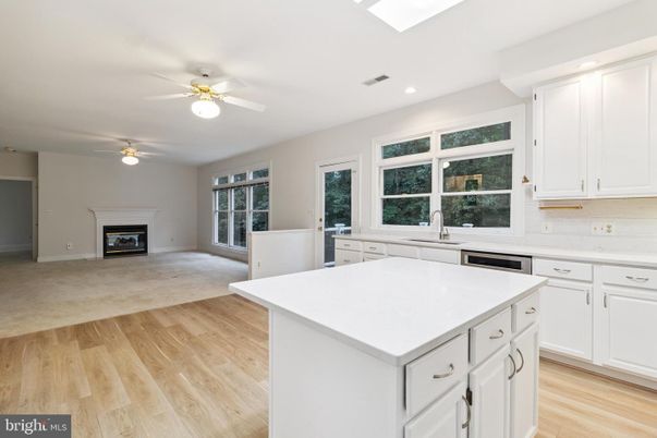 Empty room, Fireplace, Interior, Kitchen, Recessed Lighting, Wood Texture Flooring
