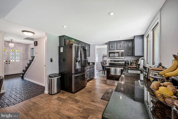 Chandelier, Dining room, Interior, Kitchen, Recessed Lighting, Stainless Steel Appliances, Wood Texture Flooring