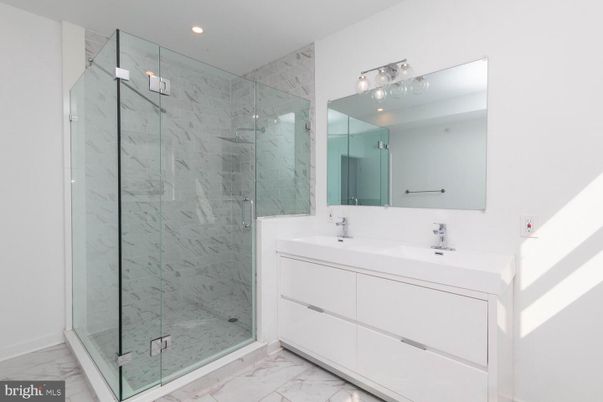 Bathroom, Dual Sink Vanities, Glass Shower, Interior, Marble, Marble Walls, Recessed Lighting