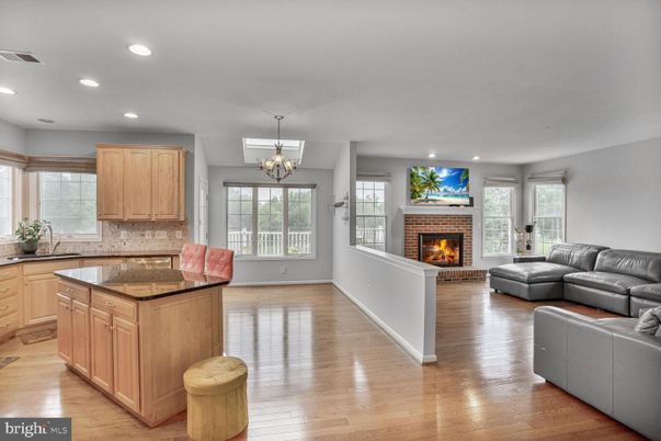 Chandelier, Fireplace, Interior, Kitchen, Living room, Recessed Lighting, Wood Texture Flooring