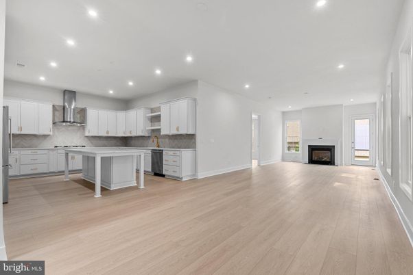 Empty room, Fireplace, Interior, Kitchen, Recessed Lighting, Wood Texture Flooring