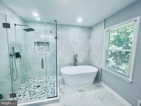 Bathroom, Free Standing Baths, Glass Shower, Interior, Marble, Marble Walls, Recessed Lighting