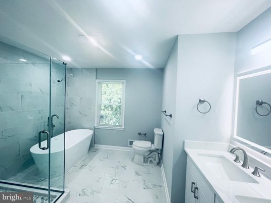 Bathroom, Dual Sink Vanities, Free Standing Baths, Glass Shower, Interior, Marble, Marble Walls, Recessed Lighting
