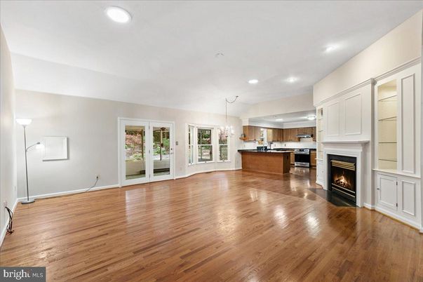 Chandelier, Empty room, Fireplace, Interior, Kitchen, Pendant Lights, Recessed Lighting, Wood Texture Flooring