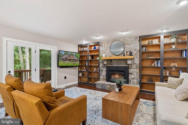Fireplace, Interior, Living room, Recessed Lighting, Stone Walls, Wood Texture Flooring