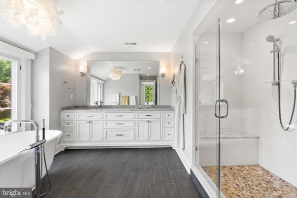 Bathroom, Dual Sink Vanities, Glass Shower, Interior, Recessed Lighting, Wood Texture Flooring