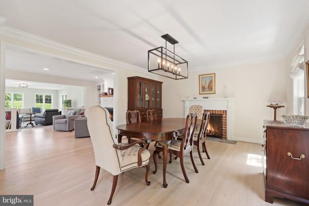Chandelier, Dining room, Fireplace, Interior, Living room, Pendant Lights, Recessed Lighting, Wood Texture Flooring