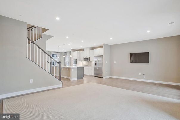 Empty room, Interior, Kitchen, Pendant Lights, Recessed Lighting, Stainless Steel Appliances, Wood Texture Flooring