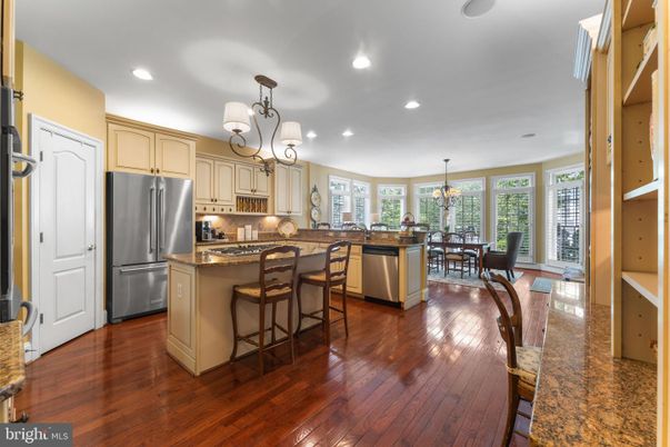 Chandelier, Dining room, Interior, Kitchen, Recessed Lighting, Stainless Steel Appliances, Wood Texture Flooring