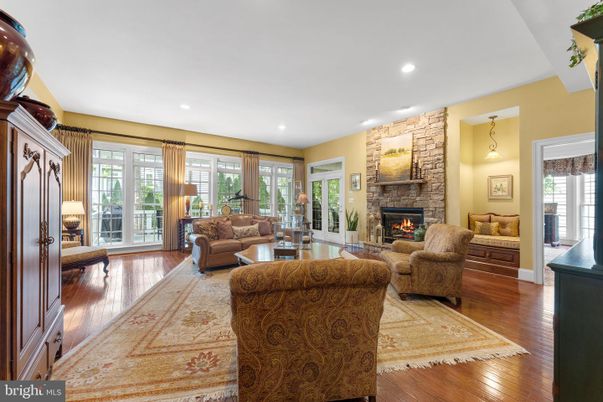 Fireplace, Interior, Living room, Recessed Lighting, Stone Walls, Wood Texture Flooring