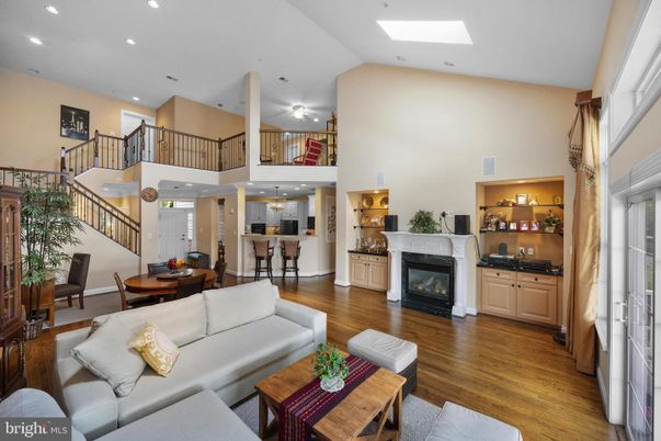 Dining room, Fireplace, Interior, Living room, Recessed Lighting, Wood Texture Flooring