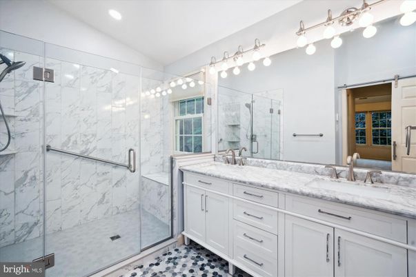 Bathroom, Dual Sink Vanities, Glass Shower, Interior, Marble Walls, Recessed Lighting