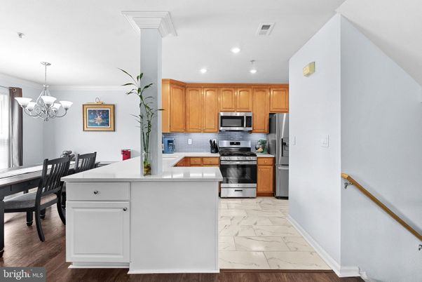 Chandelier, Dining room, Interior, Kitchen, Marble, Recessed Lighting, Stainless Steel Appliances, Wood Texture Flooring