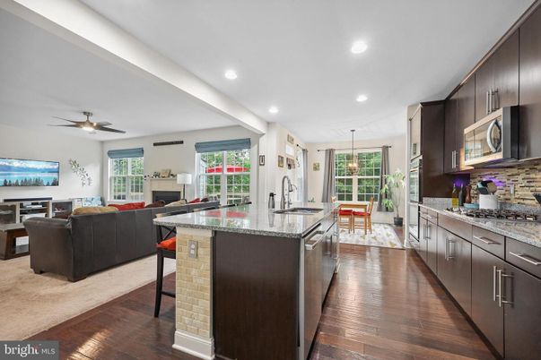 Dining room, Fireplace, Interior, Kitchen, Living room, Recessed Lighting, Wood Texture Flooring