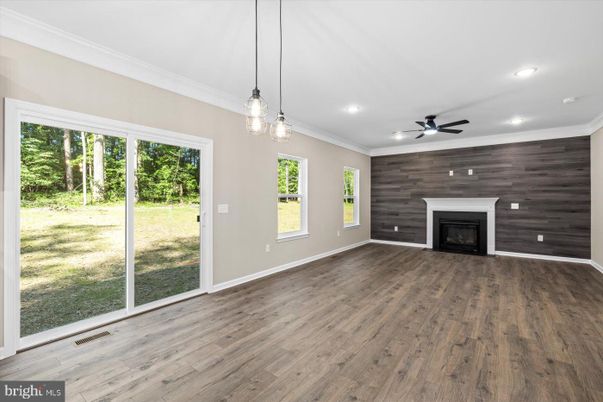 Empty room, Fireplace, Interior, Pendant Lights, Recessed Lighting, Wood Texture Flooring, Wooden Walls
