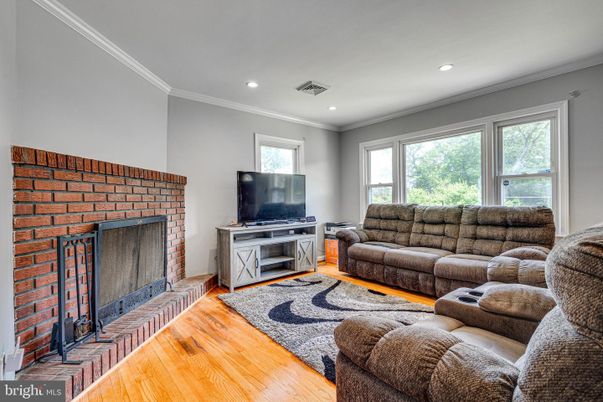 Fireplace, Interior, Living room, Recessed Lighting, Stone Walls, Wood Texture Flooring