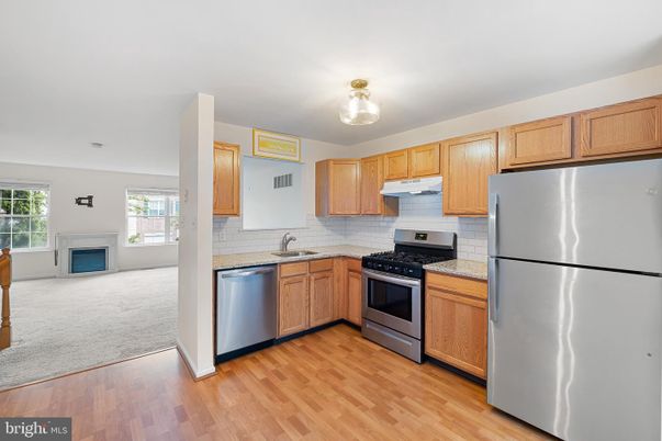 Fireplace, Interior, Kitchen, Stainless Steel Appliances, Wood Texture Flooring