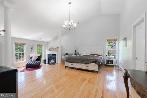 Bedroom, Chandelier, Fireplace, Interior, Wood Texture Flooring