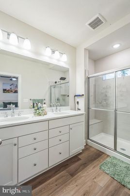 Bathroom, Dual Sink Vanities, Glass Shower, Interior, Recessed Lighting, Wood Texture Flooring