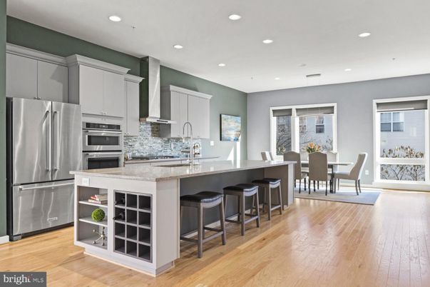 Dining room, Interior, Kitchen, Recessed Lighting, Stainless Steel Appliances, Wood Texture Flooring