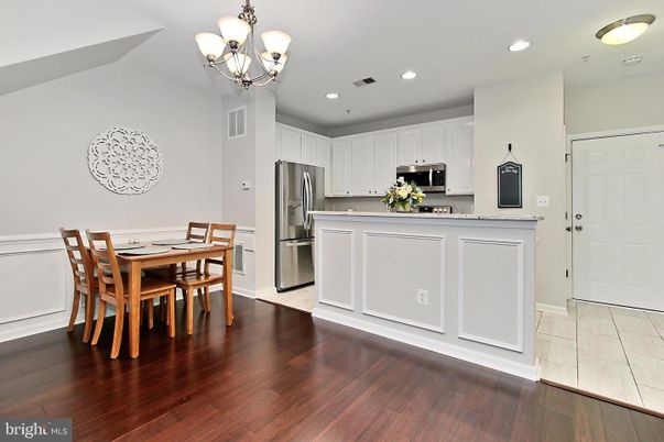 Chandelier, Dining room, Interior, Kitchen, Recessed Lighting, Stainless Steel Appliances, Wood Texture Flooring