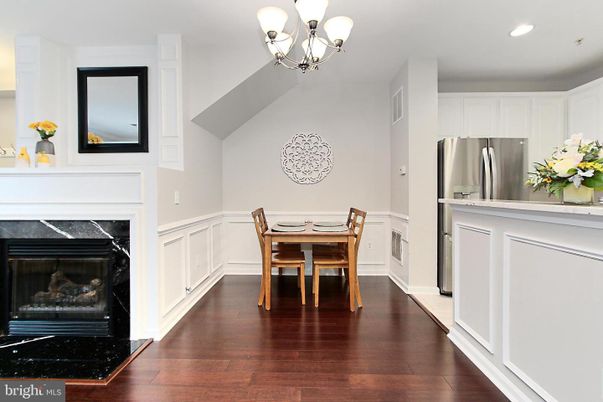 Chandelier, Dining room, Fireplace, Interior, Kitchen, Recessed Lighting, Stainless Steel Appliances, Wood Texture Flooring