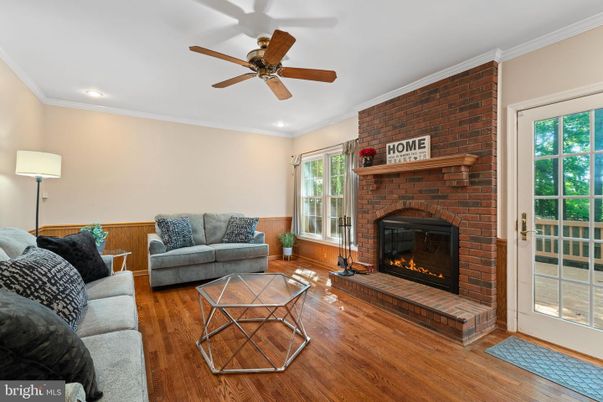 Fireplace, Interior, Living room, Recessed Lighting, Stone Walls, Wood Texture Flooring
