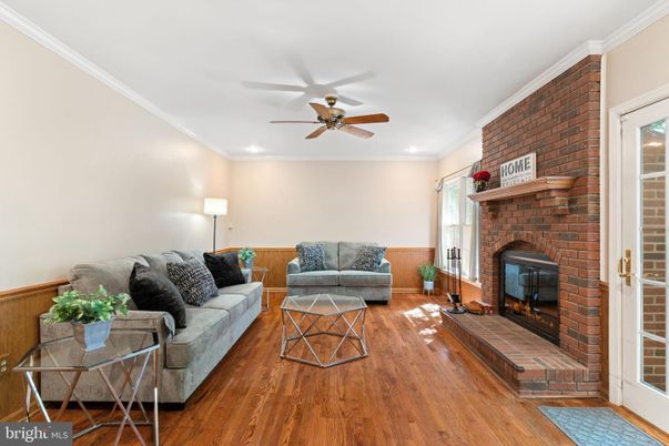 Fireplace, Interior, Living room, Recessed Lighting, Stone Walls, Wood Texture Flooring