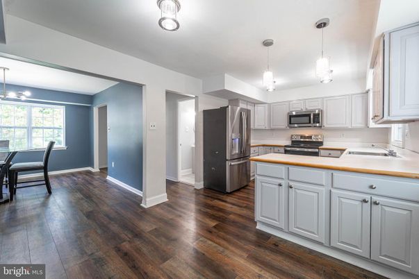Dining room, Interior, Kitchen, Pendant Lights, Stainless Steel Appliances, Wood Texture Flooring
