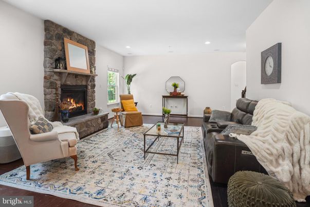 Fireplace, Interior, Living room, Recessed Lighting, Stone Walls, Wood Texture Flooring