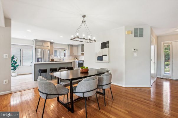 Chandelier, Dining room, Interior, Kitchen, Pendant Lights, Recessed Lighting, Stainless Steel Appliances, Wood Texture Flooring