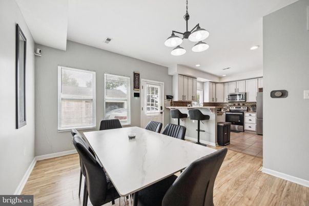 Dining room, Interior, Kitchen, Pendant Lights, Recessed Lighting, Stainless Steel Appliances, Wood Texture Flooring