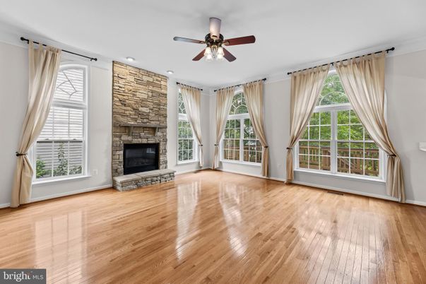 Empty room, Fireplace, Interior, Recessed Lighting, Stone Walls, Wood Texture Flooring