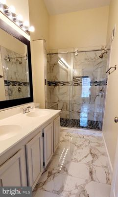 Bathroom, Dual Sink Vanities, Glass Shower, Interior, Marble, Marble Walls