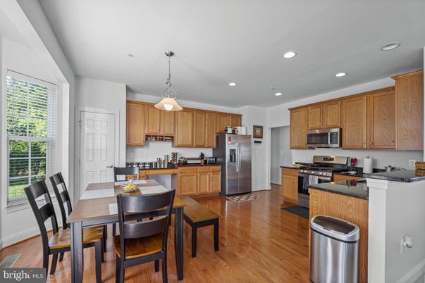 Dining room, Interior, Kitchen, Pendant Lights, Recessed Lighting, Stainless Steel Appliances, Wood Texture Flooring