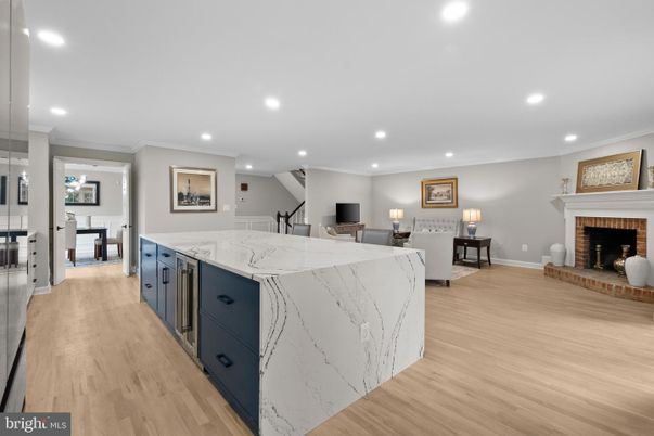 Dining room, Fireplace, Interior, Kitchen, Recessed Lighting, Wood Texture Flooring