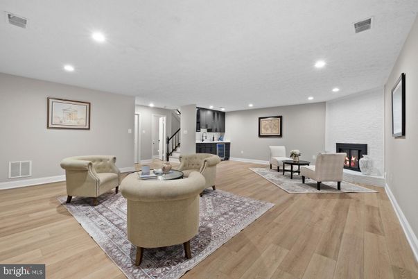 Dining room, Fireplace, Interior, Living room, Recessed Lighting, Wood Texture Flooring