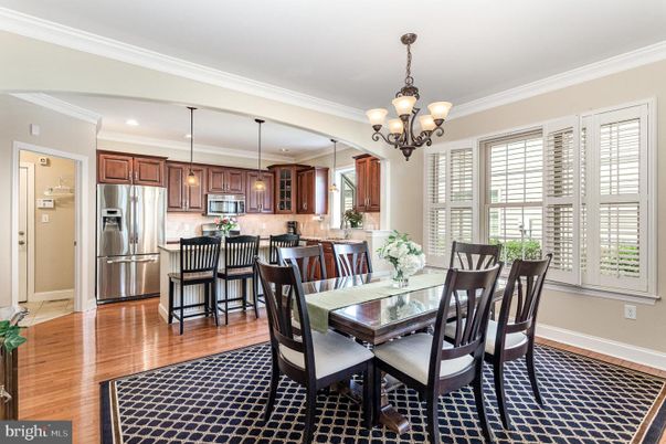 Chandelier, Dining room, Interior, Kitchen, Pendant Lights, Recessed Lighting, Stainless Steel Appliances, Wood Texture Flooring