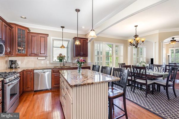 Chandelier, Dining room, Interior, Kitchen, Pendant Lights, Recessed Lighting, Stainless Steel Appliances, Wood Texture Flooring
