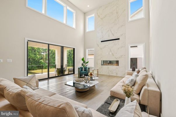 Fireplace, Interior, Living room, Marble Walls, Recessed Lighting, Wood Texture Flooring