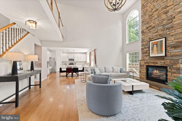 Dining room, Fireplace, Interior, Kitchen, Living room, Pendant Lights, Recessed Lighting, Stainless Steel Appliances, Stone Walls, Wood Texture Flooring