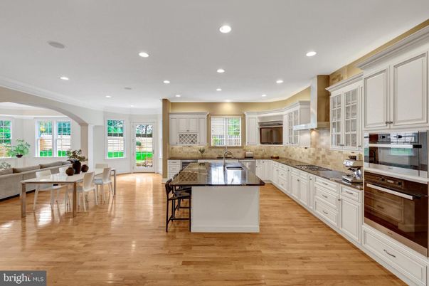 Dining room, Interior, Kitchen, Living room, Recessed Lighting, Stainless Steel Appliances, Wood Texture Flooring